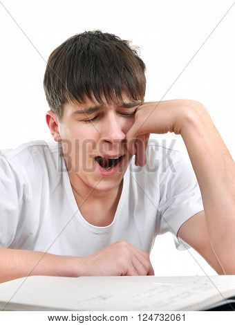 Tired Student Yawn on the School Desk Isolated on the White