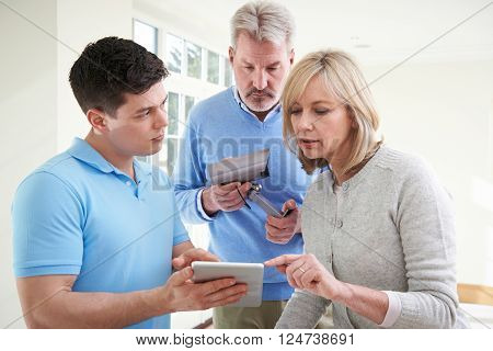 Security Consultant Demonstrating Alarm System To Mature Couple
** Note: Soft Focus at 100%, best at smaller sizes