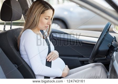 Pregnant Woman Behind The Steering Wheel Having Contractions