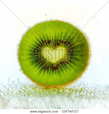 Kiwi fruit in a glass of carbonated water
