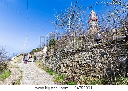 GOYNUK BOLU TURKEY - MARCH 06 2016: Local people climbing historical clock tower hill in Goynuk. Goynuk is a town and a district of Bolu Province in the Black Sea region of Turkey.