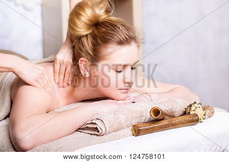 Caucasian pretty woman having body massage
Beauty treatment concept.