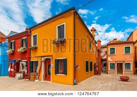 Patio with colorful houses on the famous island Burano, Venice, Italy