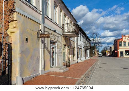 BAUSKA, LATVIA - APRIL 2, 2016: Street of old town of Bauska town with old houses and smal souvenir shops