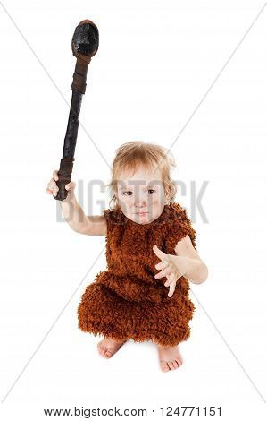 Little funny caveman boy in a suit with a dirty face holding an ax. Humorous concept ancient caveman. Isolated on white.