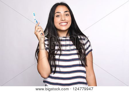Close-up woman brushing her teeth. Isolated white background.