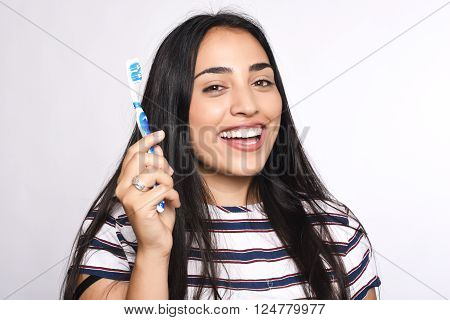 Close-up woman brushing her teeth. Isolated white background.