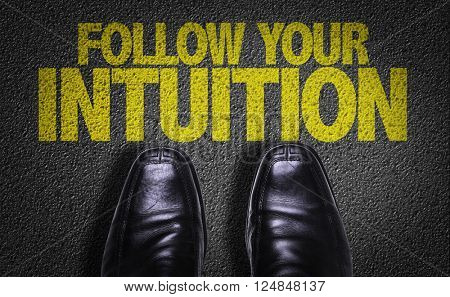 Top View of Business Shoes on the floor with the text: Follow Your Intuition