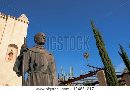April 3 2016: Photo of Mission San Gabriel Arcangel with statue of Junipero Serrawhich is located in San Gabriel Californa USA.