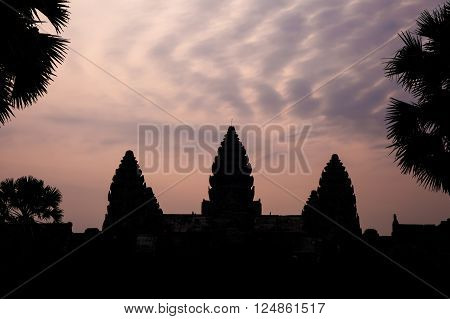 Silhouette of Angkor Wat with altocumulus clouds in twilight evening