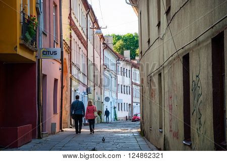 KAUNAS LITHUANIA - NOVEMBER 16: Unrecognizable couple walking along the street in old town on November 16 in Kaunas Lithuania.