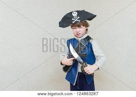 child boy playing pirate. Pirate costume on a child. The captain of a pirate ship.
