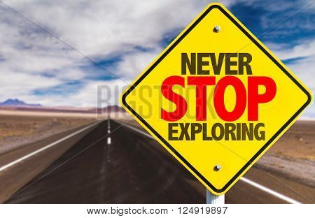 Never Stop Exploring sign on desert road