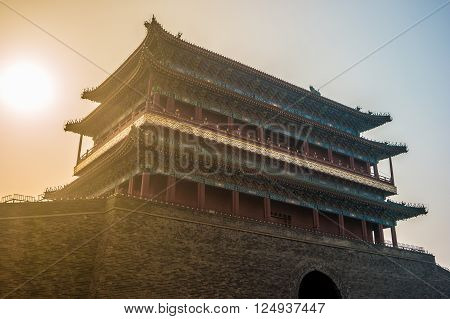 Beijing, China at the Zhengyangmen Gatehouse in Tiananmen Square. Beautiful historical building at sunset.