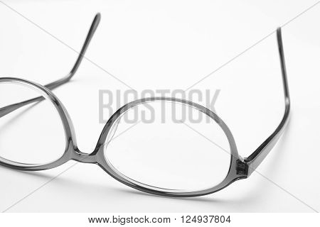 Female eyeglasses macro detail over a white background. Horizontal