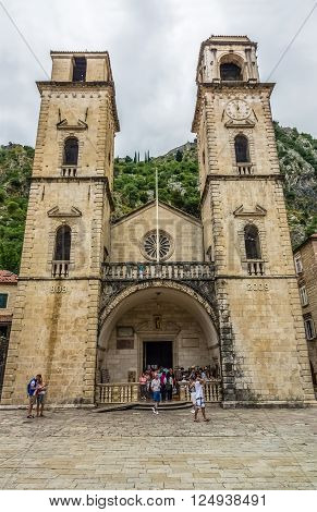 KOTOR MONTENEGRO - JUNE 18: People walking near Saint Tryphon Cathedral at June 18 2014 in Kotor Montenegro