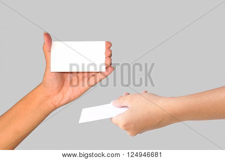 Hand holding empty white paper isolated on white background.