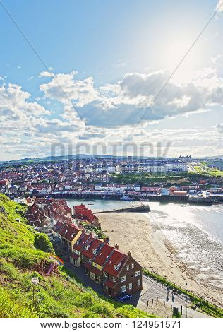 Coast of North Sea in Whitby in North Yorkshire in England. Whitby is a seaside port and town on the coast of the river Esk.