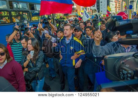 Quito, Ecuador - April 7, 2016: Closeup opposition leader Andres Paez surrounded by people, police and journalists during anti government protests in Shyris Avenue.