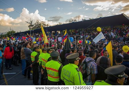 Quito, Ecuador - April 7, 2016: Police awaiting overlooking peaceful anti government protests in Shyris Avenue, beautiful blue sky and buildings background.