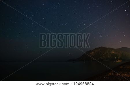 Starry sky at night at the sea coast in Cirali, Turkey - landscape exterior