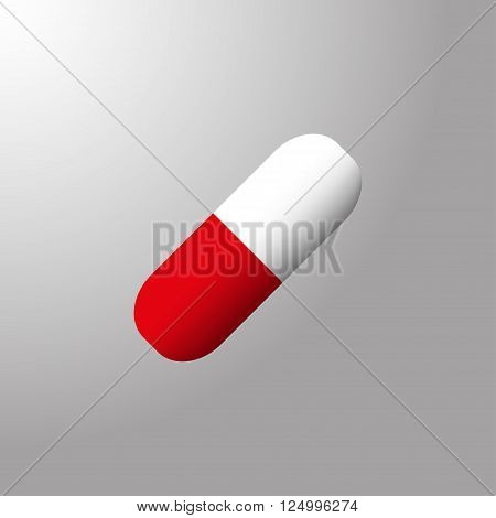 Red white gelatin tablet on the gray background