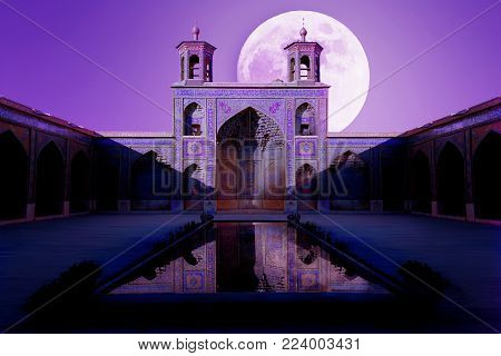 Iran, Shiraz - September 17, 2016: Colorful Mosque Nasir al Mulk in Shiraz. Reflection in water.