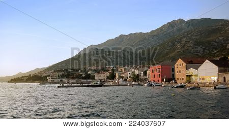 View on the coast of Karlobag town and the Velebit mountain behind it|sunset