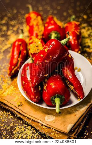 Red Chilli Pickle Marinated In Mustard Seeds And Mustard Oil. Dark Gothic Style Still Life Concept.