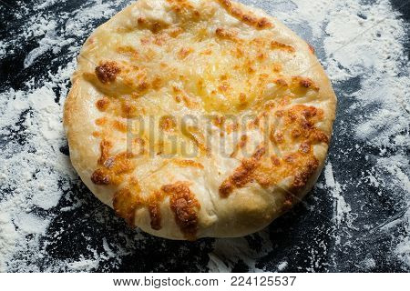 imeretian khachapuri is national Georgian cuisine dish. Baked bread with cheese filling. Delicious pastry snack