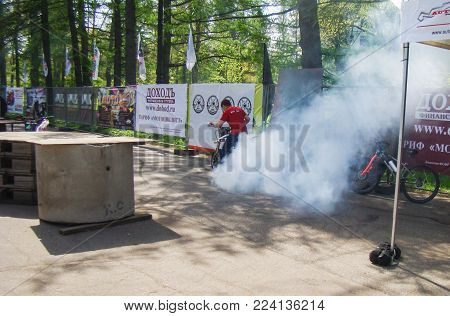 St. Petersburg, Russia - 18 May, Smoke from burnt rubber, 18 May, 2014.
Demonstration races athletes mototral to the audience.