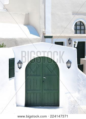 Traditional greek architecture with blue doors in the city of Pyrgos on the island of Santorini, Greece, Europe.