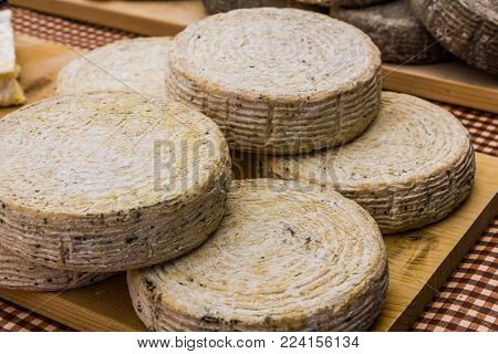 Spanish market stall with fresh artisanal cheese