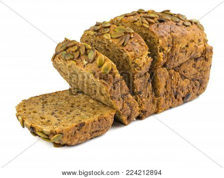 Freshly baked bread from wheat flour with sunflower seeds, pumpkin, sesame isolated on a white background. Baking for a healthy diet.