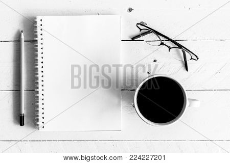Black Coffee With Notebook And Pencil On Wooden Background - Black And White