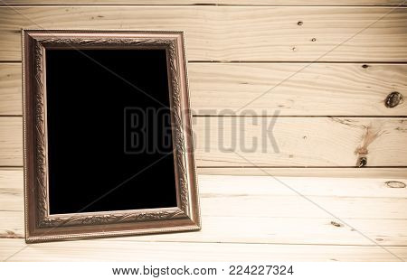 Photo Frame On Wooden Background - Vintage Tone
