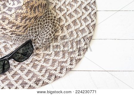 Summer Hat With  Sunglasses On White Wooden Background