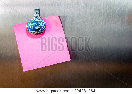 Reminder Sticky Note On A Refrigerator Door