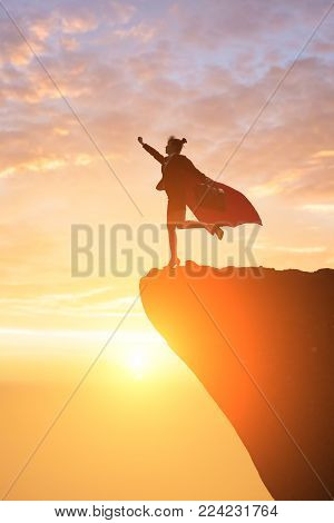 silhouette of super business woman look somewhere on the mountain