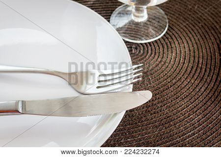 Dinner Table Set On Table In Restaurant