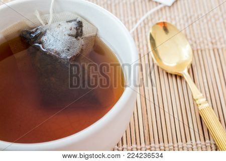 Cup Of Tea With Tea Bag On Table