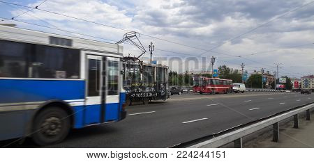 Kazakhstan, Ust-kamenogorsk, July 5, 2017: Movement of traffic along the Ulba bridge. City traffic. Urban landscape. Cityscape. Bridge over Ulba river