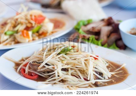 Close up Som-Tum papaya salad with Esan thai taste background