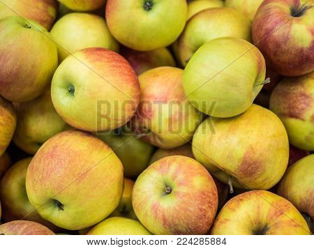 Many apples on the store counter, fruit vitamins