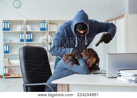 Criminal taking businesswoman as hostage in office