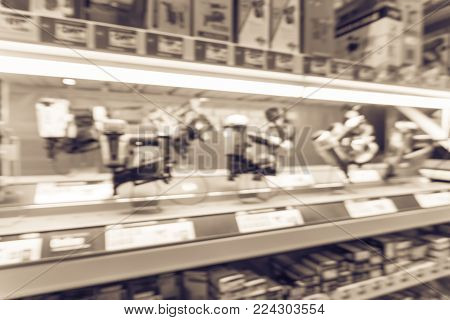 Blurred Row Of Power Tool Combo Kits At Hardware Store In America