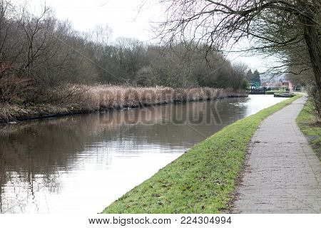 The calm and still waters of the Leeds Liverpool Canal near Wigan