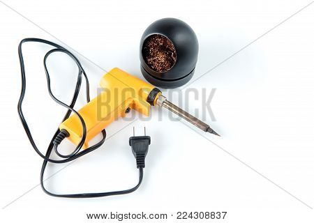 Soldering gun yellow tool on white background