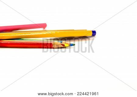 colored pencils are in a different order on a white background