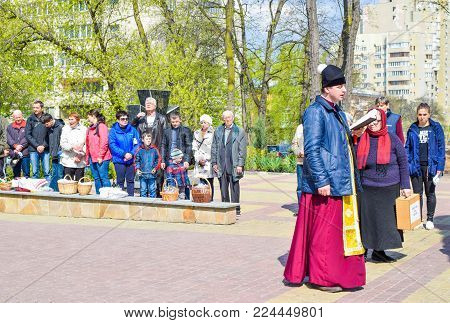 Kiev, Ukraine - April 16, 2017: The clergyman near the church during the Easter service.